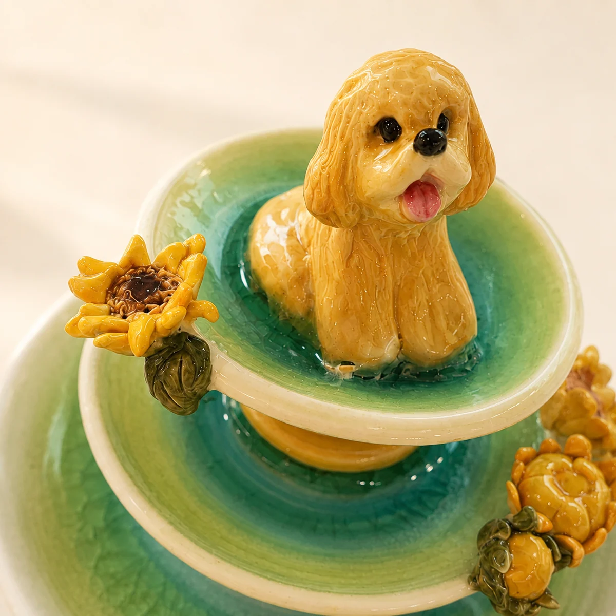 Golden pet figurine and sunflower glaze detail